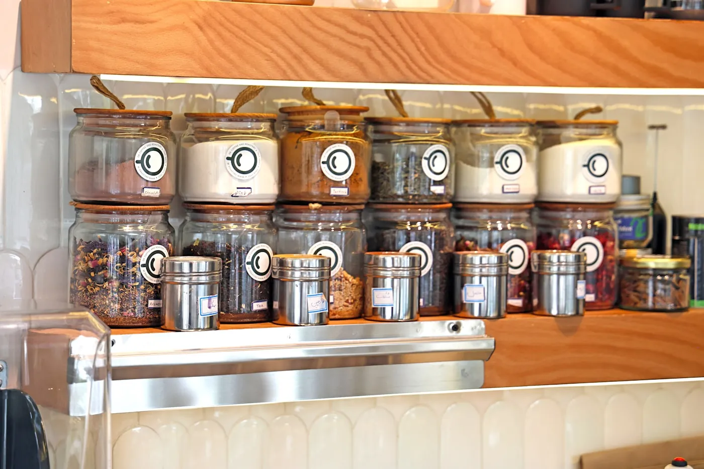 Jars and containers filled with dried pulses, spices and herbs